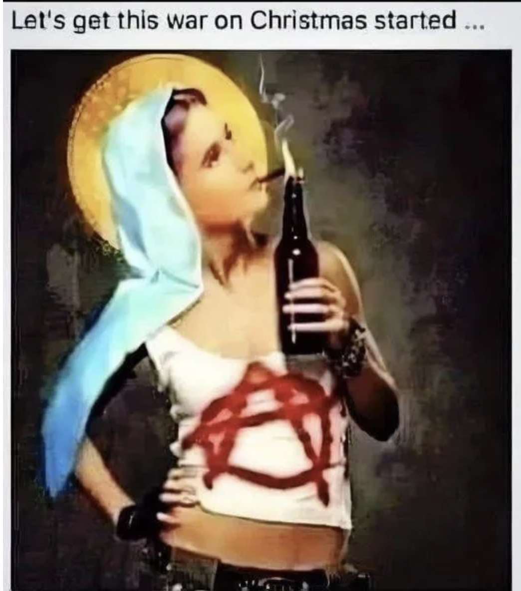 the Virgin Mary smokes a cig from a beer bottle while wearing an anarchy symbol on her holy shirt